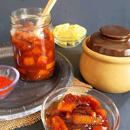 Sweet-Lemon-Pickle-stored-in-glass-bottle-and-serving-in-glass-container.jpg