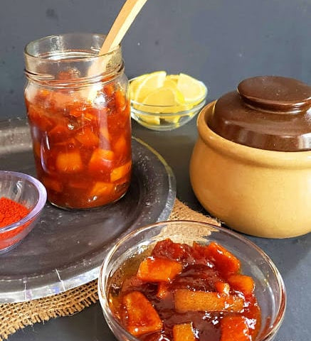Sweet-Lemon-Pickle-stored-in-glass-bottle-and-serving-in-glass-container.jpg